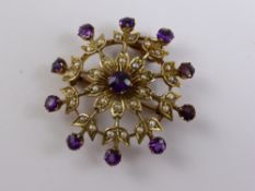 An Edwardian seed pearl and amethyst brooch / pendant in the form of a snowflake, approx 5.9 gms.