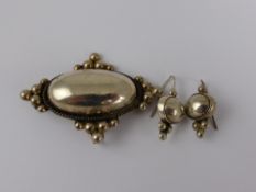 A solid silver Mexican pendant brooch and matching earrings marked 925, approx. 25 gms.