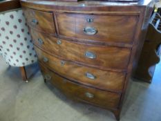 A Victorian bow front mahogany chest of drawers on bracket feet with two short and three graduated