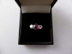 A Lady`s 18 ct White Gold Burmese Ruby and Diamond Ring, the ruby 0.77 ct the diamonds 0.70 c,size