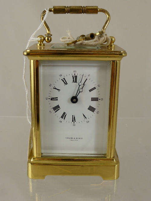 An English Brass Carriage Clock by Taylor & Bligh, approx 12 x 7 cms