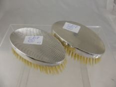 A pair of Gent`s silver topped hairbrushes having engine turned design, Birmingham hallmark, mm. A