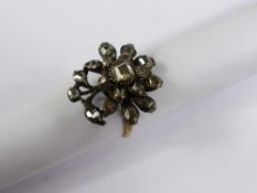 A Georgian 9ct Gold Diamond Ring, the ring in the form of a flower set with central square cut