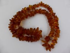 String of Rough Amber Beads, approx. 70 cms. in length, 88 gms.