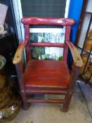 Antique red painted rustic wooden armchair having bar back, approx 50 x 46 x 82 cms.