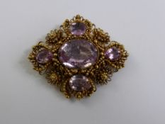 An Antique 14 / 18 ct Gold and Pink Topaz Brooch, the finely crafted brooch in a bead and floral