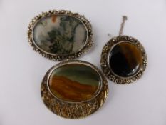 Three Solid Silver and Stone Arts and Crafts Pendants, including Agate and Tigers Eye, one m.m NWH