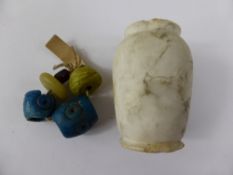 Ancient Roman Glass Beads, approx 5 in total together with a miniature white marble vase.