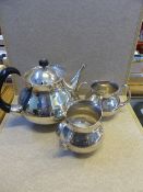 Silver plated tea set by Mappin and Webb designed by Eric Clements comprising teapot, milk jug and