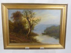 A Graham, a pair of oils on board, depicting tranquil lake scenes, presented in gilt wood frames,