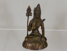 An Brass Figure of a Indian Deity, depicted seated on a tiger skin, approx 14 cms