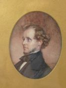 A 19th Century Oval Miniature, depicting a young gentleman, presented in a hand carved frame.