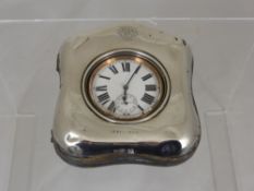 Argental Goliath Travel Clock, with Roman dial, presented in a silver case, monogram MT