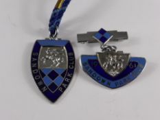 A pair of metal Sandown Park racecourse members badges ( ladies and gents ) from the 1961 season,