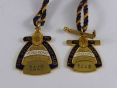 A pair of Royal Hong Kong Jockey Club members badges ( ladies and gents ) from the 1978 / 1979