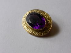 An 18 ct Gold and Amethyst Brooch 18 x 12 mm.