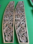 Two Dome Topped Hand Carved Hard Wood Panels, depicting flowers 43 x 24 cms.