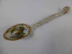 A hand painted continental porcelain spoon, circa 19th century, the bowl being decorated with