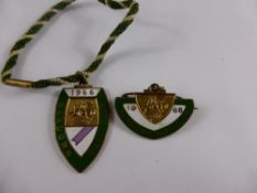 A pair of metal Sandown Park racecourse members badges ( ladies and gents ) from the 1966 season,