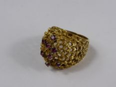 A Lady`s 18ct Yellow Gold and Ruby Dress Ring, the hand formed ring of wire mesh design set with 8