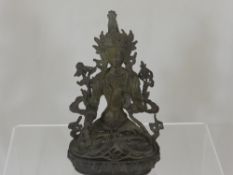 An Antique Brass Figure of a Deity, depicted seated in a contemplative pose, approx 23 cms
