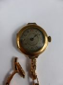 A Lady`s Vintage 9ct Gold Wristwatch, on gold bracelet.