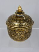 A Far Eastern Hand Painted Lidded Pot, the hand painted pot having floral gilded decoration over a