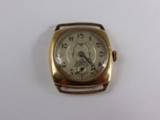 A 9ct Gold Vintage Gents Wristwatch, circa 1920`s, the watch having a silver patterned face,