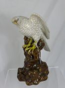 Continental Figure of a Bird of Prey seated, approx 32 cms