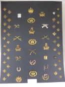 A collection of approximately six army trade qualification badges and rank badges including