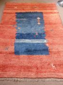 A Large Heavy Wool Carpet, possibly Mexican, approx 215 x 165 cms, the carpet being red with blue