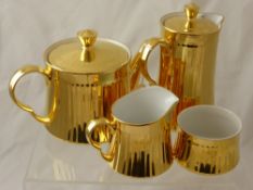 A Part Royal Worcester Tea Set, comprising Gilded Teapot, Water Jug, Milk Jug and Sugar Bowl.