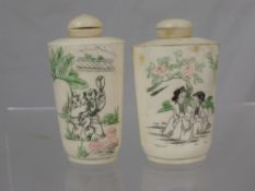 A Pair of Antique Chinese Bone Scent Bottles, one depicting a young boy the other a young girl in a