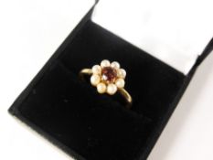 A Lady`s 9 ct hallmark Seed Pearl and Garnet Cluster Ring, garnet 4.5 mm, size O, 2.7 gms.