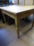 A Vintage Scrubbed Pine Kitchen Table, on the original castors approx 106 x 85 x 74 cms