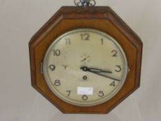 A German Second World War Wall Clock, the silver face having a 3rd Reich emblem, the clock