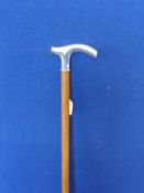 A silver handled walking cane.