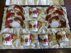 A Royal Crown Derby Hand Painted Coffee Set in original presentation box, impressed to base No.