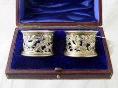 A Pair of Solid Silver Napkin Rings, in the original red leather presentation box, London hallmark,