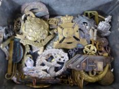 An old cobra boot polish tin containing approximately forty military badges including Rifle