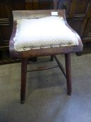 An oak stool on turned legs and stretchers together with a gilt framed hall table having a marble