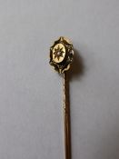 A Gentleman`s 15 ct Gold and Diamond tie pin.