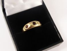 A 9ct Gold Gentleman`s Three Stone Garnet Ring, Size M, approx 3.4 gms.