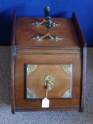 An Edwardian mahogany and brass coal scuttle.