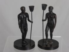 Two Black Painted late 19th / early 20th century Male Athlete Figures carrying torches, 20 cms