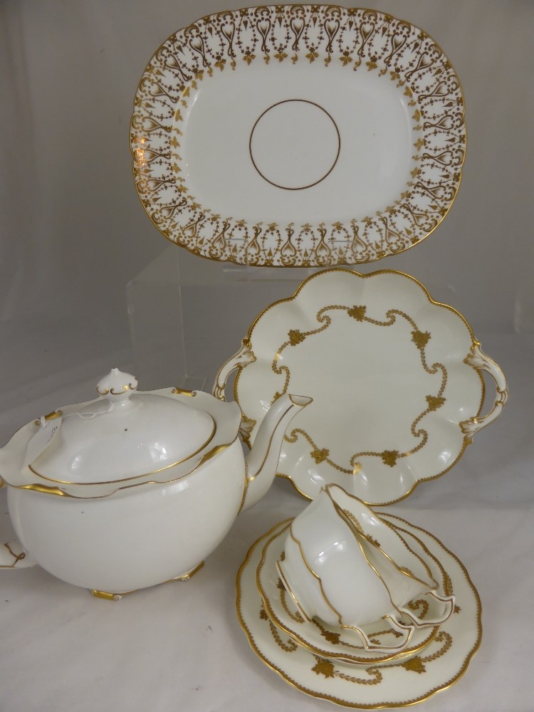 A Part Crescent & Son Bone China ""Gold"" Tea Set, the white and gilded tea set having applied rose