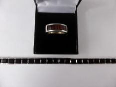 A Lady`s Silver and Garnet Bracelet, the bracelet set with 23 garnets 7 x 5 mm, approx length 16.5