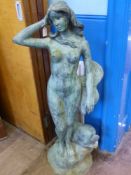 A Contempory water feature in the form of a naked lady with a fish standing on a rock, est height