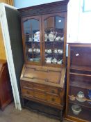 Edwardian oak bureau bookcase, glazed front to the top, the interior being fitted with pigeon holes