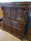 17th century style oak court cupboard having a carved frieze with two cupboards to the top and a